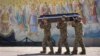 Ukraine -- Soldiers carry the coffin of their comrade, a Ukrainian military officer killed during fighting against Russians, during his funeral at St Michael cathedral in Kyiv, Ukraine, Thursday, Sept. 8, 2022. 