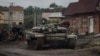 Ukraine -- A destroyed Russian tank is seen in the town of Izium liberated by Ukrainian Armed Forces, Kharkiv region, September 14, 2022.