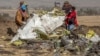 ETHIOPIA -- Rescuers work at the scene of an Ethiopian Airlines flight crash near Bishoftu, or Debre Zeit, south of Addis Ababa, Ethiopia, Monday, March 11, 2019.