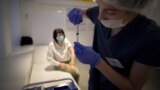 RUSSIA -- A healthcare worker prepares a dose of Russia's Sputnik V Covid-19 vaccine, at a vaccination centre in Moscow, July 2, 2021