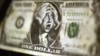 Germany -- A fake US dollar bill imprinted with the image of a deeply shocked George Washington at Frankfurt Stock Exchange, 25Feb2009