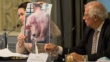 BELGIUM -- Belarusian opposition leader Svyatlana Tsikhanouskaya shows torture pictures next to EU foreign policy chiefJosep Borrell during an informal breakfast with EU foreign affairs ministers in Brussels, September 21, 2020