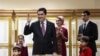 Turkmenistan - Turkmen President Gurbanguly Berdymukhamedov, speaks to journalists after casting his ballot as his son Serdar (second right) stands with other family members at a polling station in Ashgabat in February 2017.